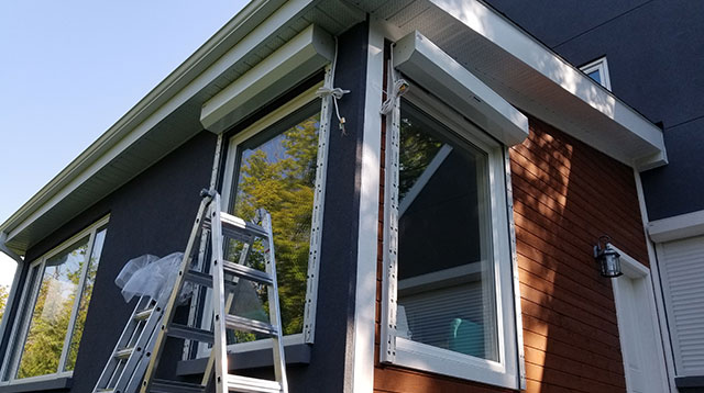 Exterior window roll up shutter installation